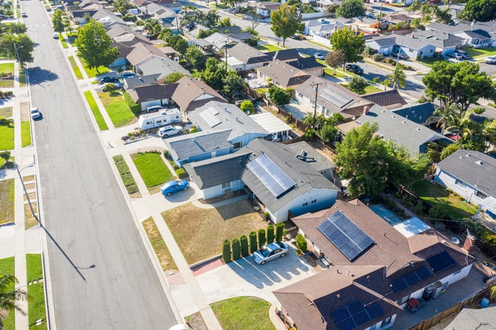 Solar panels installed on a modern HOA community rooftop, generating clean energy.